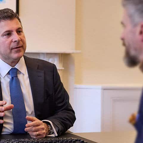 Dr Dionysis Papadatos-Pastos, consultant medical oncologist, during a patient consultation discussing lung cancer diagnosis and treatment options